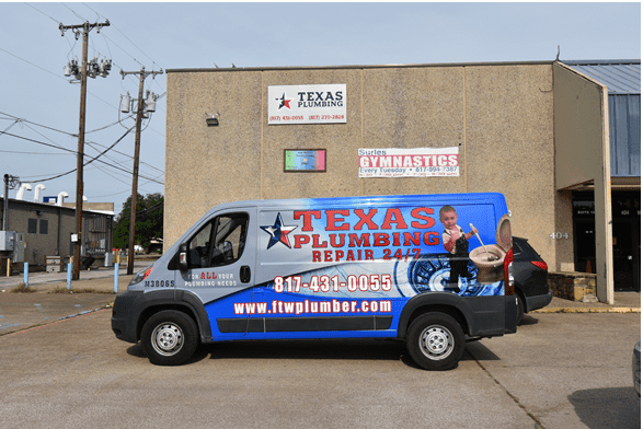 A Texas Plumbing Repair 24/7 van outside of their storefront